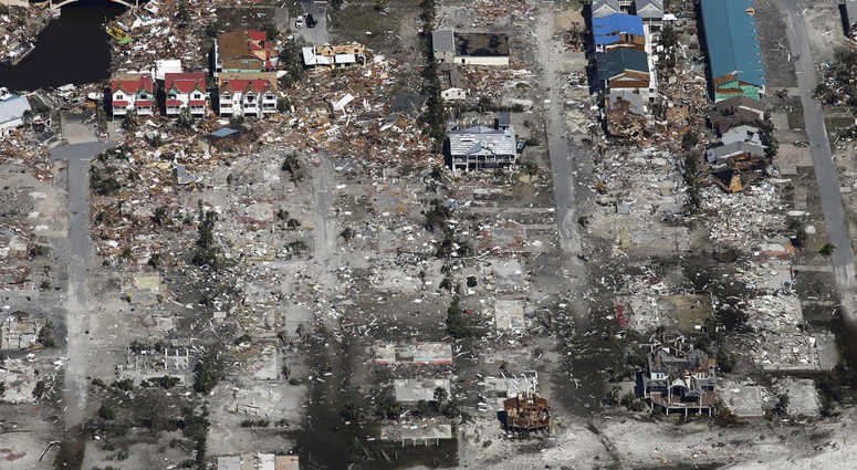 Rescue personnel search amidst debris in the aftermath of Hurricane Michael in Mexico Beach, Fla.