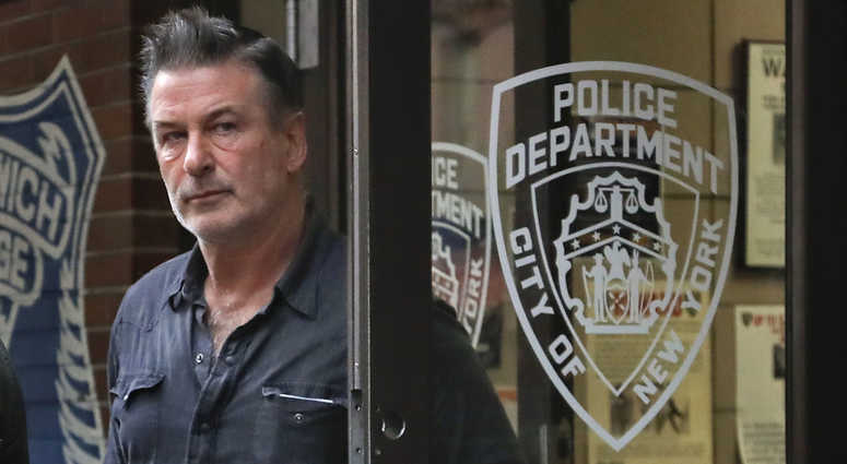 Actor Alec Baldwin walks out of the New York Police Department's 10th Precinct, Friday, Nov. 2, 2018, in New York. Baldwin was arrested Friday after allegedly punching a man in the face during a dispute over a parking spot outside his New York City home, alec baldwin punch