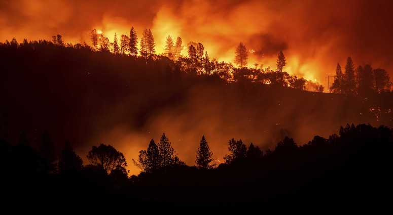 The Camp Fire burns along a ridgetop near Big Bend, Calif., on Saturday, Nov. 10, 2018. Crews working to contain the blaze overnight faced deteriorating weather conditions according to CalFire as winds picked up and humidity dropped. AP Photo/Noah Berger