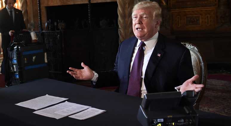 President Donald Trump speaks to reporters following his teleconference with troops from his Mar-a-Lago estate in Palm Beach, Fla., Thursday, Nov. 22, 2018. Trump