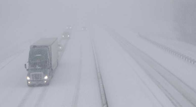 Traffic moves west along I-70 near Lawrence, Kan., Sunday, Nov. 25, 2018. I-70 is closed west of Junction City, Kan. midwest snow