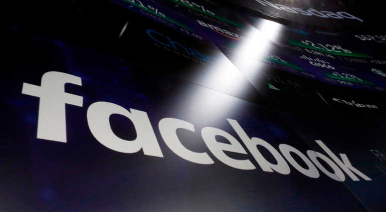 The logo for Facebook appears on screens at the Nasdaq MarketSite in New York's Times Square in March 2018. Facebook