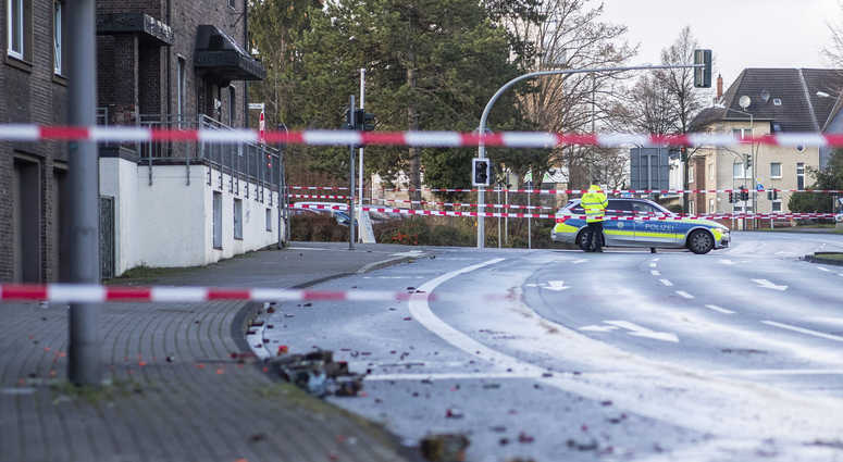The Police blocks a road in Bottrop, Germany, Tuesday, Jan. 1, 2019. Germany crowd car