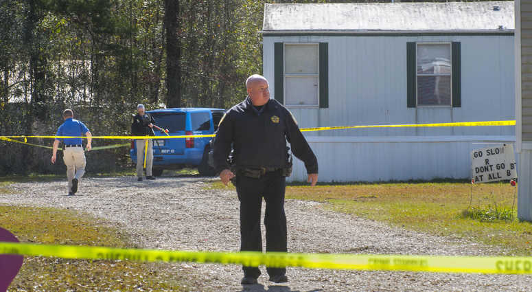Investigators work the scene of a shooting in Livingston Parish in Louisiana. Authorities in Louisiana say a shooting has left five people dead in two parishes. Louisiana shooting