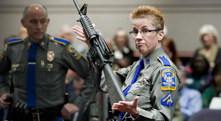 firearms training unit Detective Barbara J. Mattson, of the Connecticut State Police, holds a Bushmaster AR-15 rifle firearms training unit Detective Barbara J. Mattson, of the Connecticut State Police, holds a Bushmaster AR-15 rifle