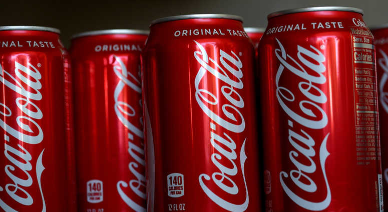 SAN RAFAEL, CA - JULY 25: Cans of Coca Cola are displayed on July 25, 2018 in San Rafael, California. SAN RAFAEL, CA - JULY 25: Cans of Coca Cola are displayed on July 25, 2018 in San Rafael, California.