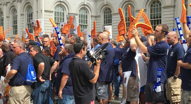 Cops rally outside city hall after a year without a contract. Cops rally outside city hall after a year without a contract.