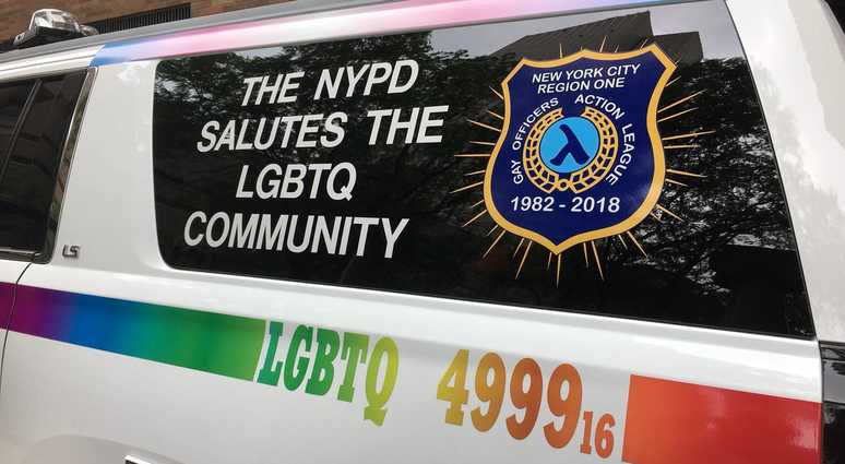 A police van decorated in a rainbow for the NYC LGBT Pride March. NYPD Gay Pride