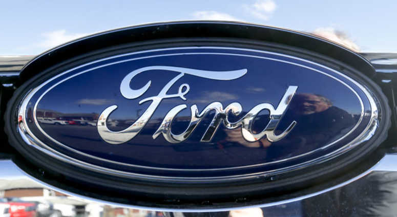 This Nov. 19, 2015 file photo shows the blue Ford oval badge in the grill of a pickup truck This Nov. 19, 2015 file photo shows the blue Ford oval badge in the grill of a pickup truck