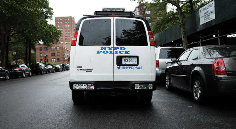A New York City Police Department (NYPD) van is parked near housing projects in the Brownsville section of Brooklyn NYPD in Brownsville