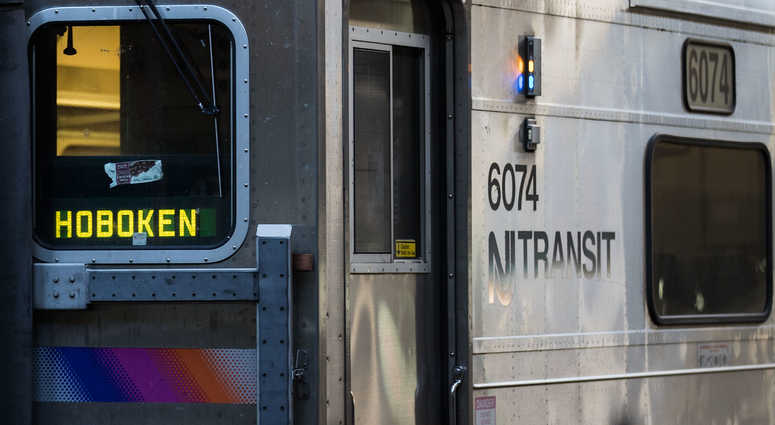 A New Jersey Transit train arrives at Hoboken Terminal during morning rush hour A New Jersey Transit train arrives at Hoboken Terminal during morning rush hour