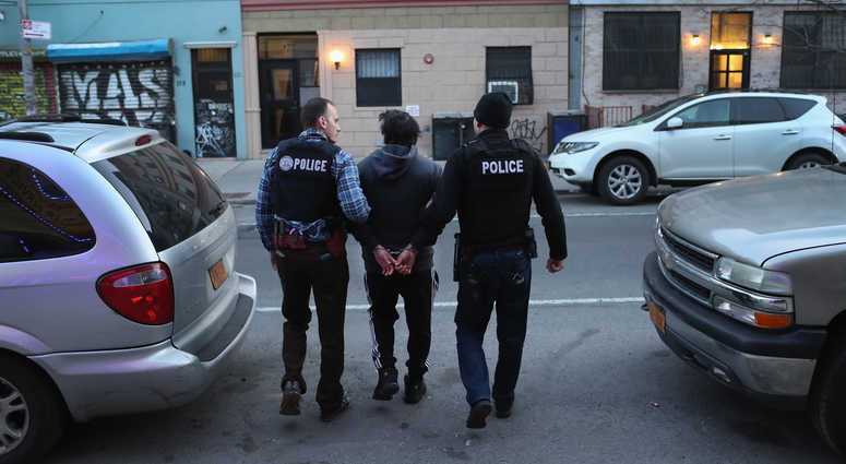 U.S. Immigration and Customs Enforcement (ICE), officers stage a raid to arrest an undocumented immigrant on April 11, 2018 in New York City. New ICE raid