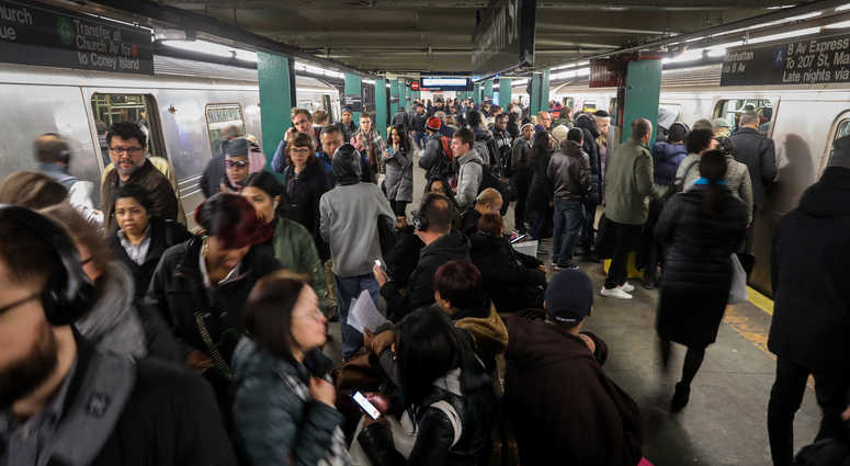 ge crowds gather during the morning rush hour at the Hoyt-Schermerhorn subway station. Subway