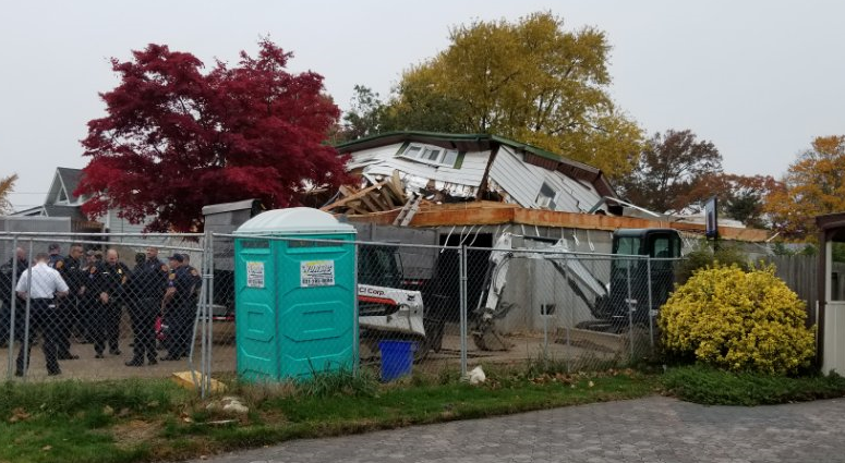 A house being raised in Babylon collapsed when a hydraulic jack failed. A house being raised in Babylon collapsed when a hydraulic jack failed.