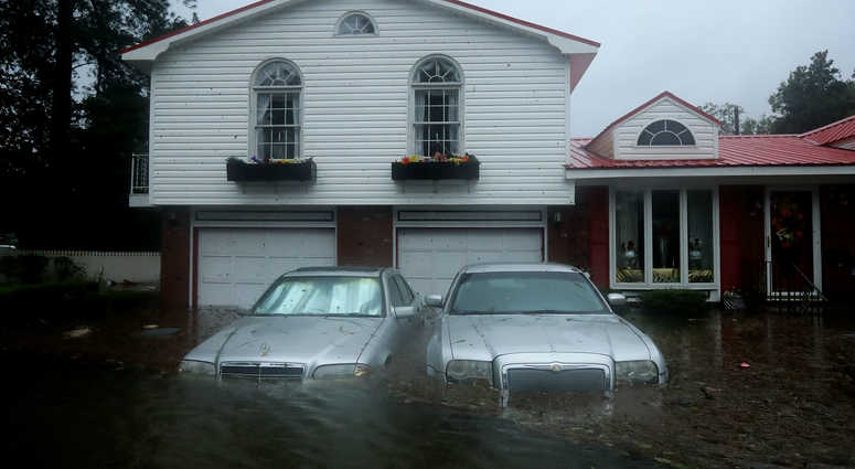 NEW BERN, NC - SEPTEMBER 14: Homes are flooded after a storm surge from Hurricane Florence flooded the Neuse River September 14, 2018 in New Bern, North Carolina. Hurricane Florence made landfall in North Carolina.