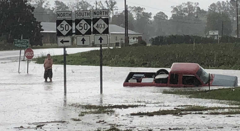 A truck is swept away by flood waters in North Carolina Florence