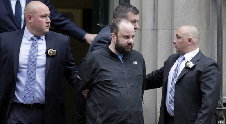 Marc Lamparello, 37, center, is escorted out of a police precinct in New York, Thursday, April 18, 2019. Marc Lamparello, 37, center, is escorted out of a police precinct in New York, Thursday, April 18, 2019.