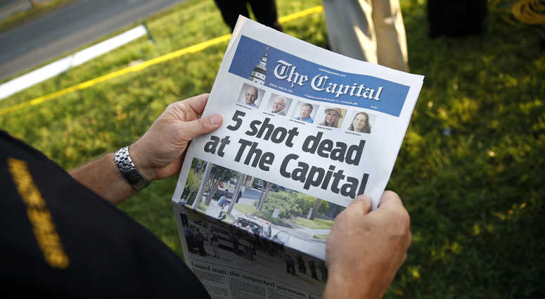 Steve Schuh, county executive of Anne Arundel County, holds a copy of The Capital Gazette near the scene of a shooting at the newspaper's office, Friday, June 29, 2018, in Annapolis, Md. Steve Schuh, county executive of Anne Arundel County, holds a copy of The Capital Gazette near the scene of a shooting at the newspaper's office, Friday, June 29, 2018, in Annapolis, Md.