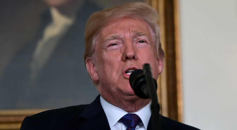 President Donald Trump speaks in the Diplomatic Reception Room of the White House on Friday, April 13, 2018, in Washington, about the United States' military response to Syria's chemical weapon attack on April 7.