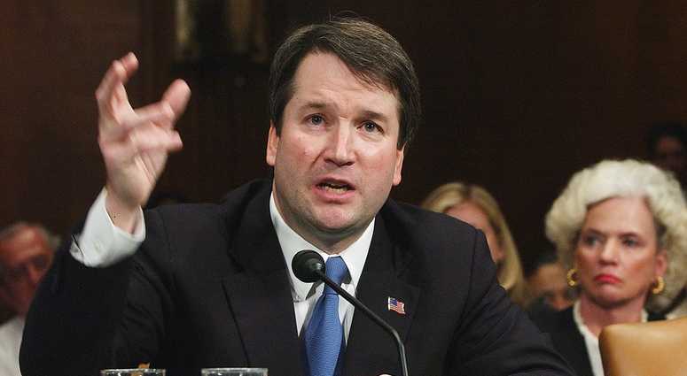 FILE -In this April 26, 2004, file photo, Brett Kavanaugh appears before the Senate Judiciary Committee on Capitol Hill in Washington.