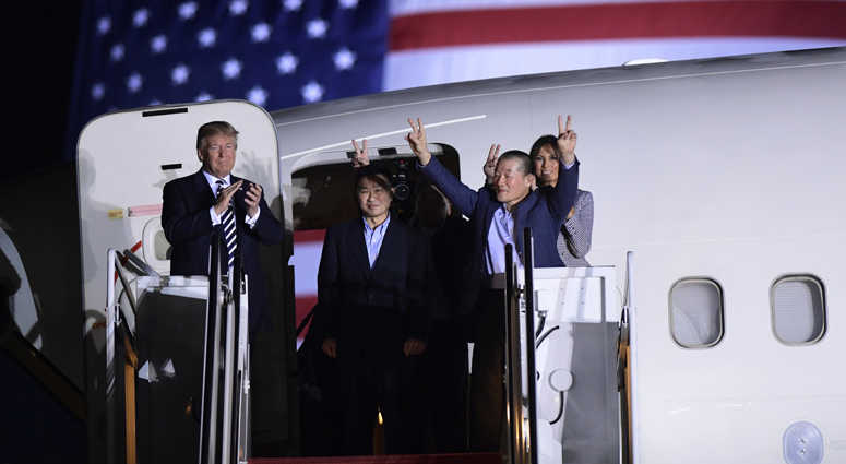 President Donald Trump, from left, greets Tony Kim, Kim Hak Song, seen in the shadow, and Kim Dong Chul, three Americans detained in North Korea for more than a year, as they arrive at Andrews Air Force Base in Md., Thursday, May 10, 2018. President Donald Trump, from left, greets Tony Kim, Kim Hak Song, seen in the shadow, and Kim Dong Chul, three Americans detained in North Korea for more than a year, as they arrive at Andrews Air Force Base in Md., Thursday, May 10, 2018.
