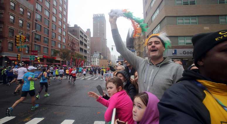 Willie Graham of New York City, along with his family, cheer runners as make their way up 1st Ave. in Manhattan during the TCS New York City Marathon. nyc marathon 2017