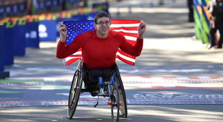 Daniel Romanchuk poses for a photo after winning the men's push rim wheelchair race in the 2018 TCS New York City Marathon. NYC Marathon