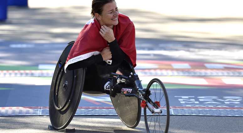 Manuela Schar reacts after winning the women's push rim wheelchair race at the 2018 TCS New York City Marathon. NYC Marathon
