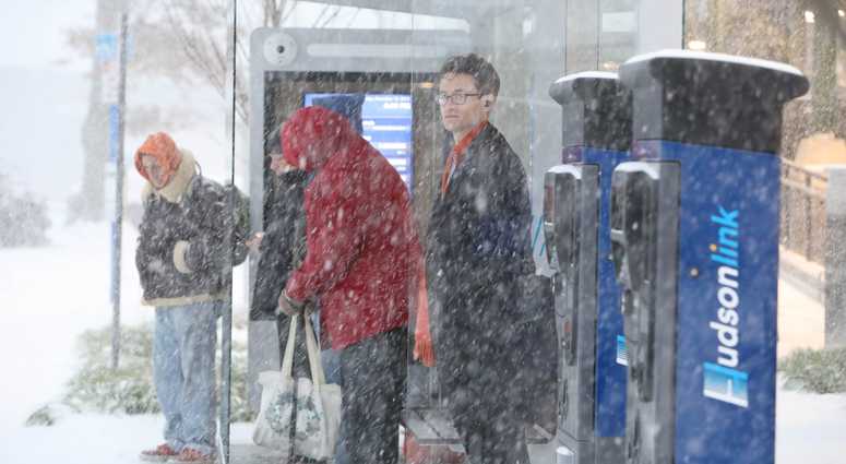 Commuters wait for train in snowy Yonkers