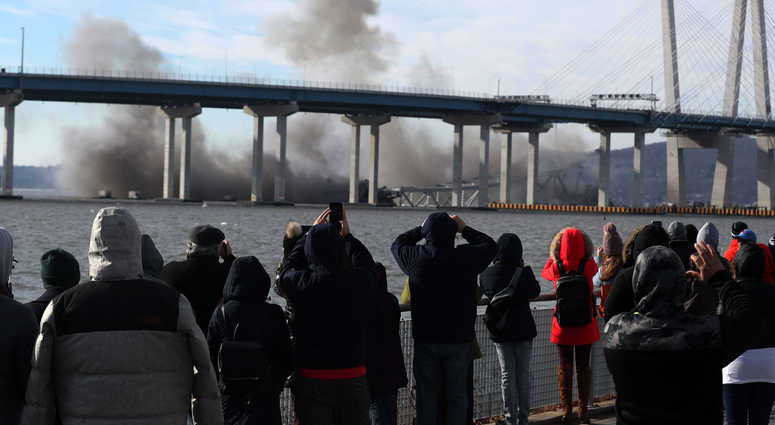 Spectators watch from Tarrytown as the Tappan Zee Bridge comes down with an implosion Jan. 15, 2019. Tappan Zee Bridge