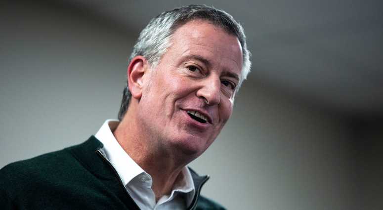 New York City Mayor Bill de Blasio, who is considering a run for president, addresses a gathering of people during a meet and greet event hosted by the Asian & Latino Coalition on Sunday, Feb. 24, 2019, in Des Moines. Bill de Blasio
