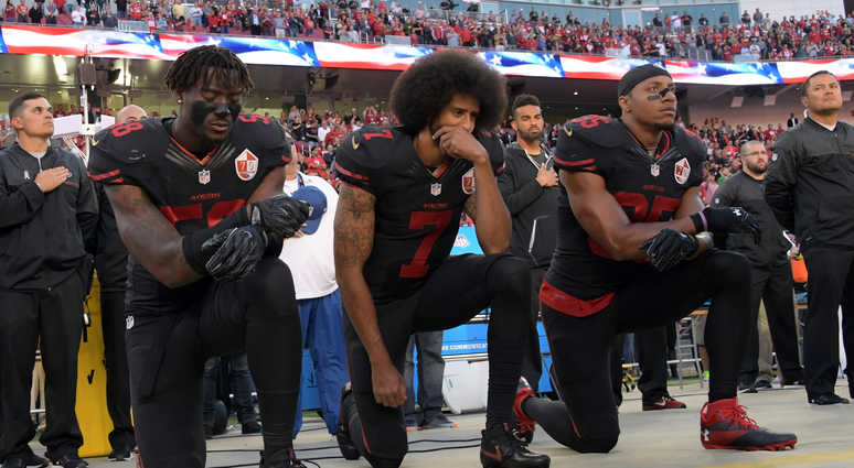 San Francisco 49ers outside linebacker Eli Harold (58), quarterback Colin Kaepernick (7) and free safety Eric Reid (35) kneel in protest during the playing of the national anthem before a NFL game San Francisco 49ers outside linebacker Eli Harold (58), quarterback Colin Kaepernick (7) and free safety Eric Reid (35) kneel in protest during the playing of the national anthem before a NFL game