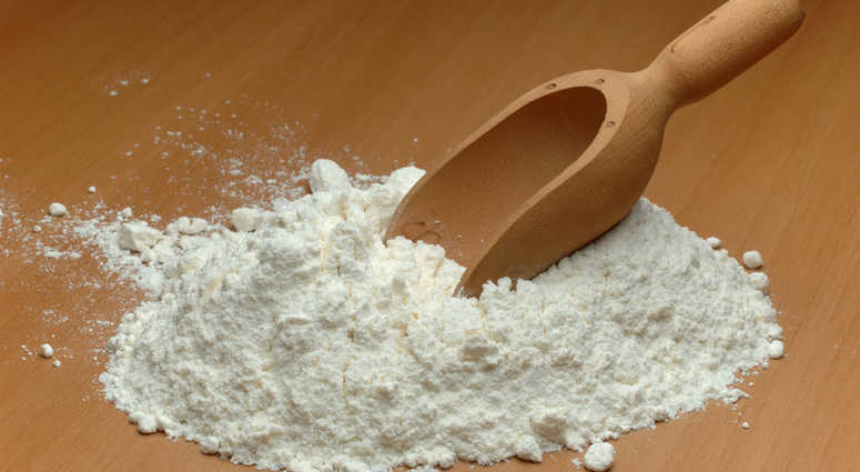 Flour and a wooden spoon. Flour