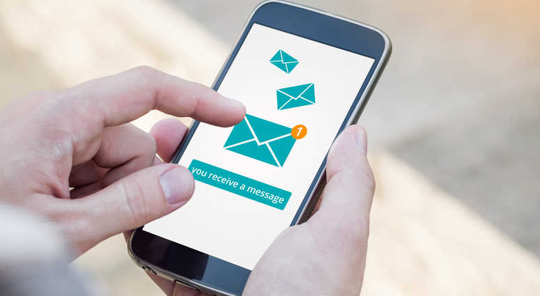 Email app on smartphone screen. You receive a message, New message is received. Man's Hand holding a smartphone Email app on smartphone screen. You receive a message, New message is received. Man's Hand holding a smartphone