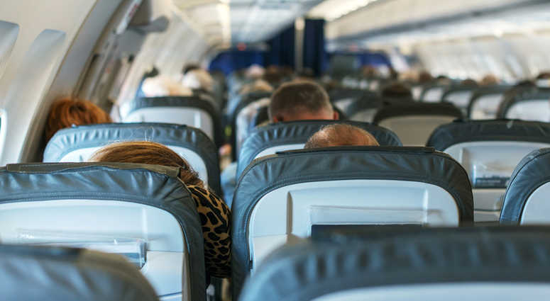 Inside of the plane with passengers. Inside of the plane with passengers.