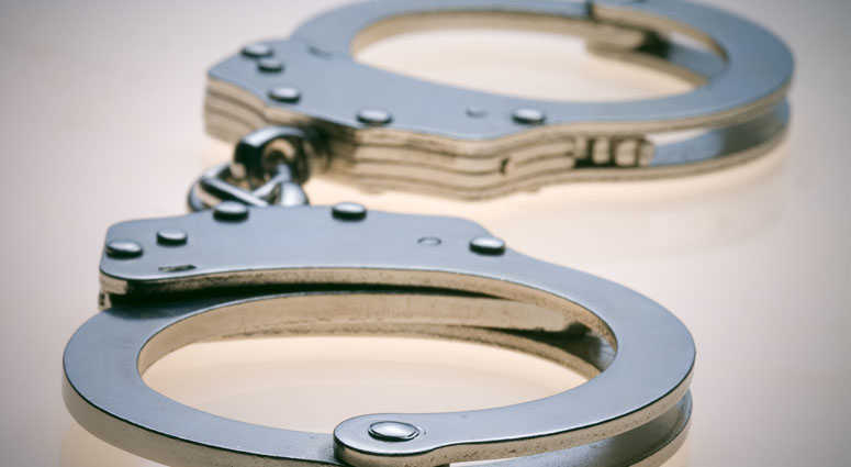 The three men face burglary charges in connection with the spree. handcuffs