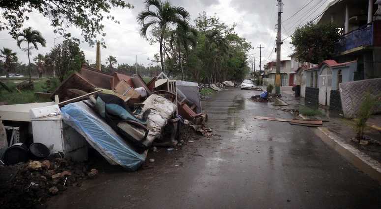 Debris left over from Hurricane Maria as well as furniture, appliances and washed out vehicles, litter a street in Toa Baja Puerto Rico, on October 12, 2017. Debris left over from Hurricane Maria as well as furniture, appliances and washed out vehicles, litter a street in Toa Baja Puerto Rico, on October 12, 2017.