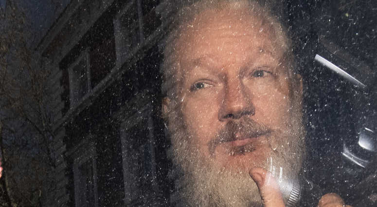 Julian Assange after his arrest Thursday. Julian Assange