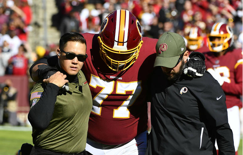 Shawn Lauvao helped off the field after suffering a knee injury in the first quarter against Atlanta Shawn_Lauvao_Injury
