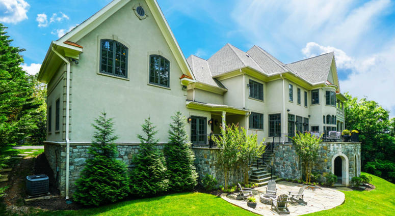 Back of Bruce Allen's McLean home. Bruce Allen's McLean, Virginia mansion is up for sale again.