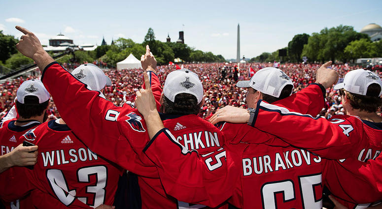 CITY OF RED: Your 2018 Stanley Cup Champions The Capitals embrace in front of 500,000 fans on the National Mall.