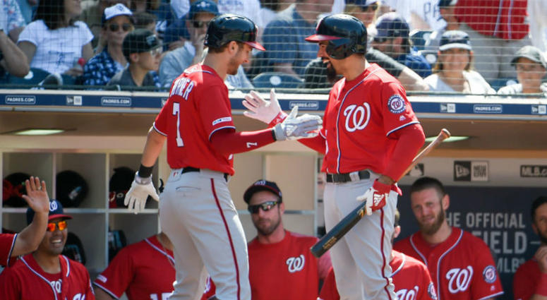 Anthony Rendon and Trea Turner celebrate a HR. Nationals hit four-straight home runs in the 8th inning to beat the Padres.