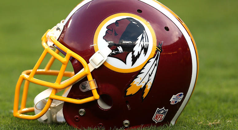 A Redskins helmet sits on the field Redskins_Helmet