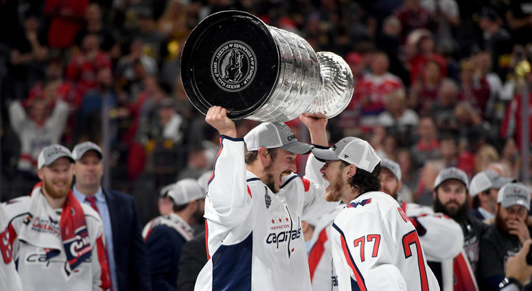 T.J. Oshie hands the Stanley Cup off to Jay Beagle TJ_Oshie_Jay_Beagle_Stanley_Cup