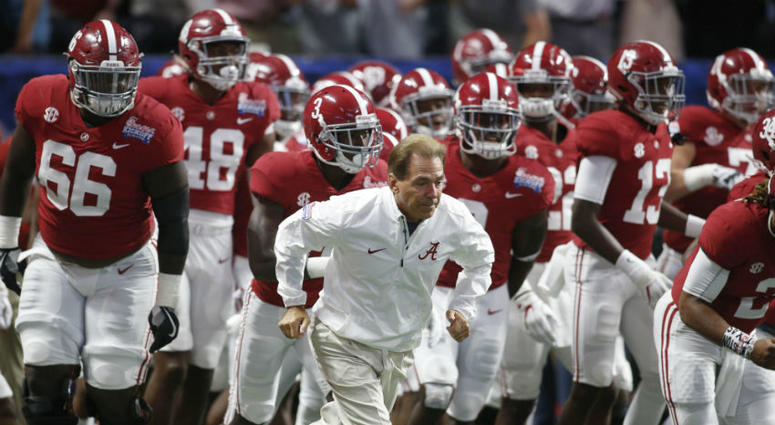 Nick Saban leads his Alabama Crimson Tide onto the field. Will Redskins rekindle the Alabama connection at the NFL Draft?