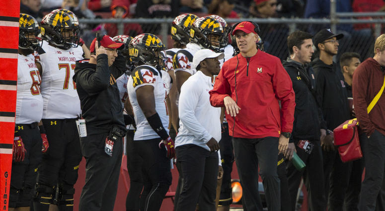 Maryland coach DJ Durkin and players standing on the sideline. DJ_Durkin_Maryland