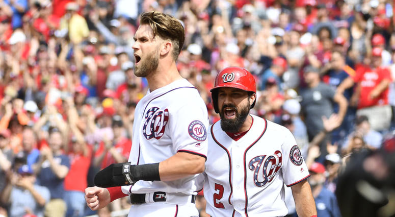Bryce Harper and Adam Eaton celebrate after scoring against the Braves Bryce_Harper