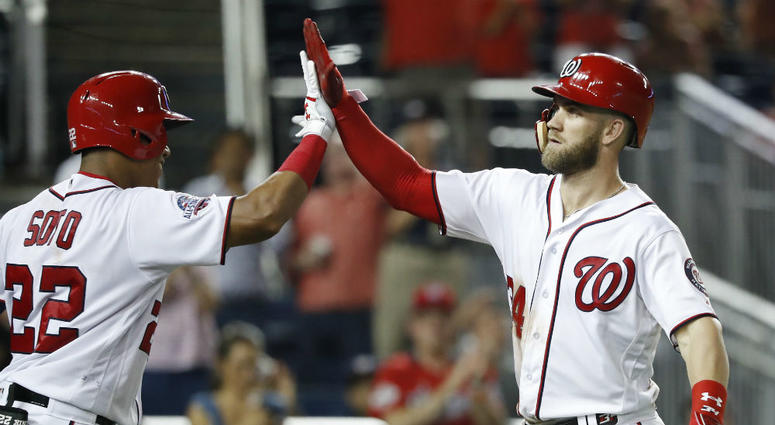 Nationals outfielder Bryce Harper gives a high-five. Bryce_Harper_Nationals