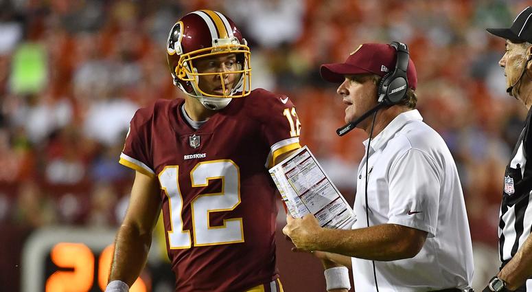 Colt McCoy and Jay Gruden talk on the sideline. Schedule gives Redskins veteran QBs edge over potential rookie replacement.