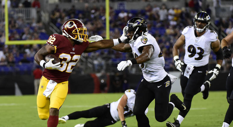 Samaje Perine stiff-arms a defender. Samaje_Perine